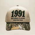 Cap with '1991 Natures Classic' text on a beige background