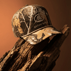 Beige and camouflage cap with '1991 Natures Classic' text on a beige background