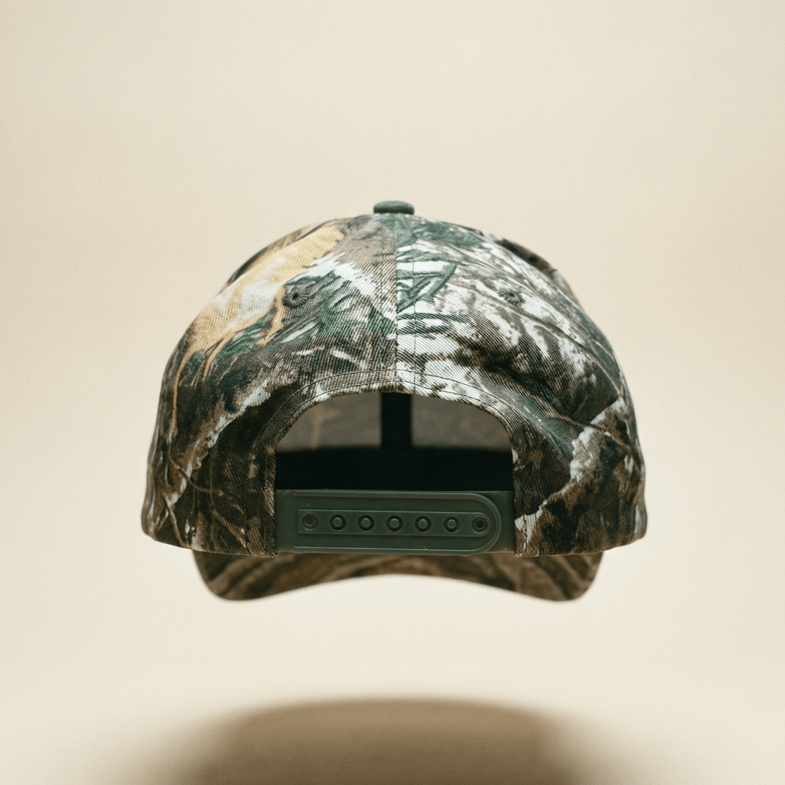 Camouflage-patterned cap on a beige background