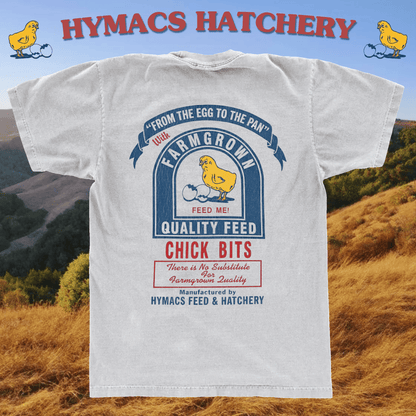 T-shirt with Hymacs Hatchery branding and graphic on a scenic background