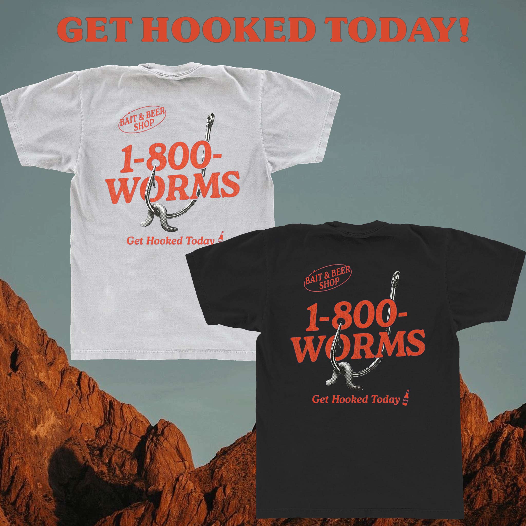 White and black t-shirts with '1-800-WORMS' text and fishing hook design on a desert background.
