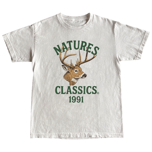 White t-shirt with a deer graphic and 'Natures Classics 1991' text on a green background