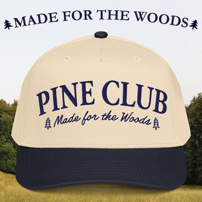 Beige and navy cap with 'Pine Club Made for the Woods' text against a forest background